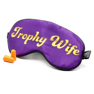 Purple satin sleep mask with gold "Trophy Wife" lettering, includes orange foam earplugs, novelty sleep accessory for women